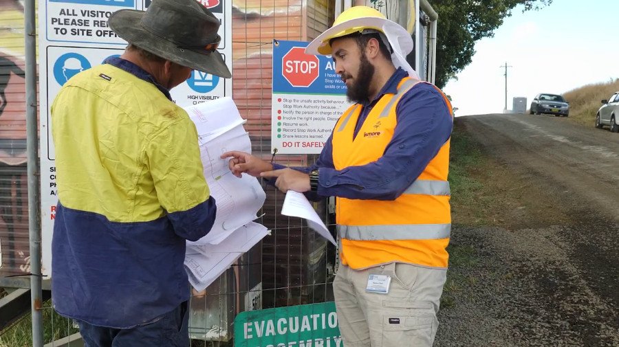 Council workers look over documents.