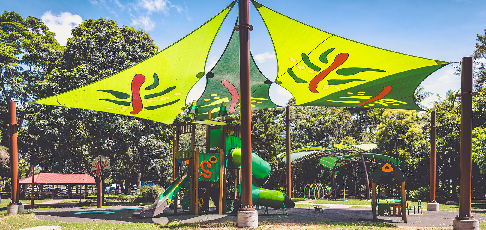 shade sails cover the playground